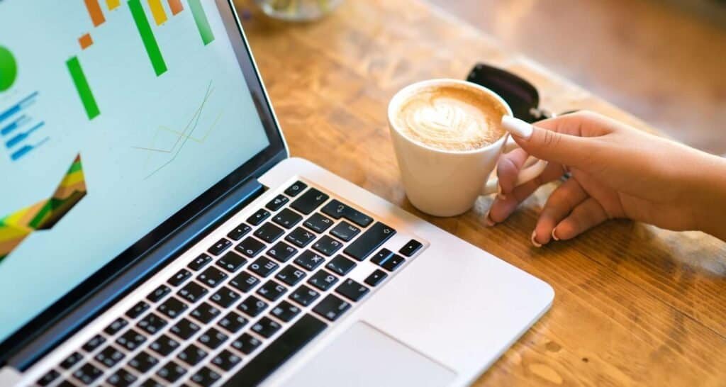 digital nomad working with laptop in a coffee shop